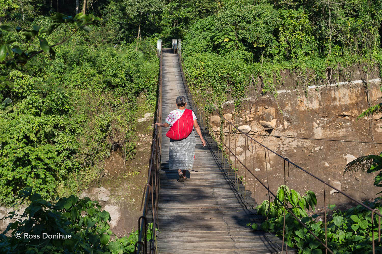 A woman walking to work in the town of El Palmar, a region that has been severely been affected by volcanic threats.